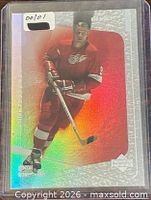 Front of holographic Gordie Howe Upper Deck card in sleeve, sticker 001/01 visible