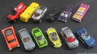 All twelve Hot Wheels vehicles arrayed