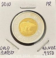 Coin in 2×2 holder showing polar bear reverse and writing on holder