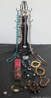 Full lot with stand and jewelry pieces displayed