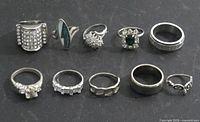 Group shot of all ten silver-tone rings