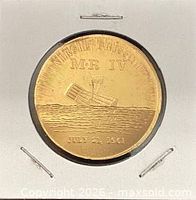 Obverse of bronze medal showing capsule, MR IV text and date July 21 1961