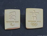 Both gold-plated Vancouver 2010 pins side by side