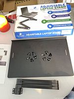 Stand platform with fan vents, leg section, original box visible