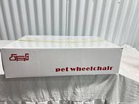 Front of closed box showing red text "pet wheelchair"