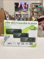 Retail box of the car multimedia player showing product features and image of unit
