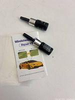 All kit components: two applicators, curing films, instruction leaflet