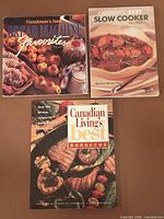 Front covers of three softcover cookbooks