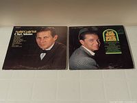 Front jackets of both LPs