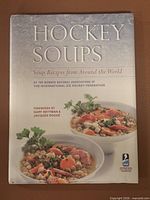 Front cover showing title, subtitle, soup imagery, IIHF logo