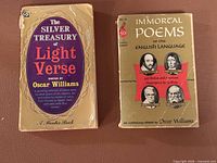 Front covers of both paperbacks showing titles and condition wear