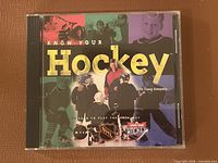 Front of jewel case showing title, Craig Simpson image, NHL and Axia logos