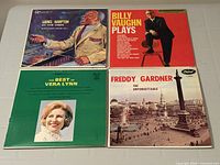 Front covers of all four vinyl LPs