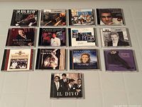 Front covers of all nine CDs laid out for identification