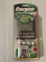 Front of sealed Energizer e2 charger in blister packaging
