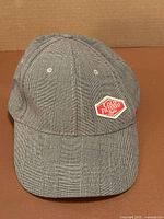 Front view showing plaid pattern and Cold Filtered Light patch logo