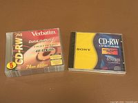 Front view showing sealed Verbatim 5-pack and sealed Sony single CD-RW