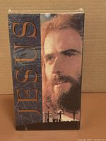 Front view of sealed "Jesus" VHS cassette with shrink wrap intact and artwork visible