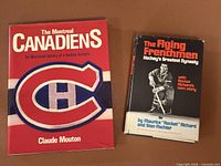 Front covers of both hardcover books showing titles and designs