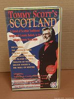 Front cover of Tommy Scott’s Scotland VHS showing title graphics and artist image