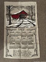 Front view of full linen calendar showing covered bridge illustration and 1972 months