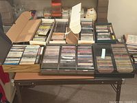 Overall view of multiple boxes and cassette storage cases on table