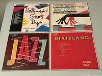 Top-down view showing all four record album covers