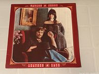 Front sleeve showing album art and titles