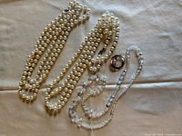 All four jewelry pieces arranged together