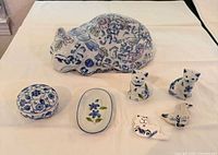 All seven Delft-style ceramic items displayed