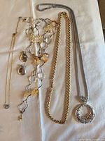 All five jewelry pieces laid out together for overview