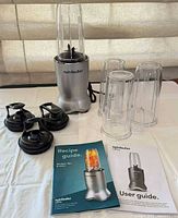 Full set with motor base, four cups, three lids, recipe and user guides