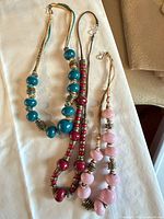 All three beaded necklaces laid out together