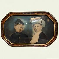Front view of framed double portrait