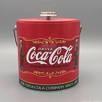 Front view showing Coca-Cola graphics, lid and knob