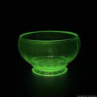 Bowl fluorescing bright green under UV light