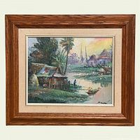 Full view of framed riverside village painting