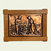 Front view of framed copper relief plaque