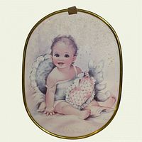 Full view of framed oval nursery print