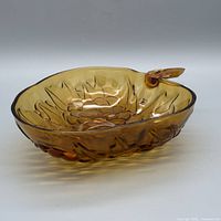 Oblique view showing overall shape, amber color and leaf handle