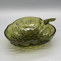 Side view of avocado green pressed glass bowl