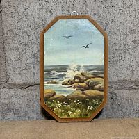 Full view of octagonal wood plaque with seascape painting