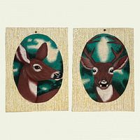 Both wood panels showing deer head paintings