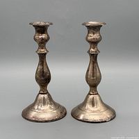 Front view of both silver-plated candlesticks