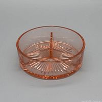 Oblique view showing overall form, pink color and central divider