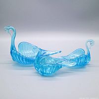 Three aqua glass swan bowls side view
