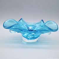 Front view showing ruffled rim and clear base