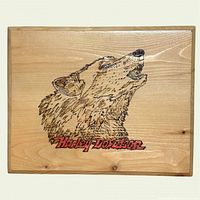 Front of plaque showing wolf pyrography and Harley-Davidson logo