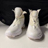 Front view of both cleats with zip shroud closed showing overall condition