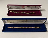 Two bracelet cases opened showing bracelets